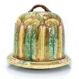 A majolica cheese dome and stand, relief decorated with stylised leaves and flowerheads on a mottled