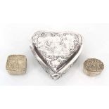 A late Victorian silver repousse decorated box and cover of heart shaped form, maker ETB, London
