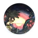 A Moorcroft limited edition cabinet plate for 2000 decorated with a tropical island at sunset, d.