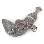 An Omani silver filigreework dagger decorated in the traditional manner, l. 32.5 cm, overall 29