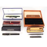 A small stationary group including cased Waterman fountain pen, a Parker pen case, two Shaeffer
