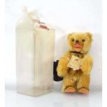 A limited edition Hermann Berlin bear, 668/2000 with small fragment of the Berlin Wall and tags