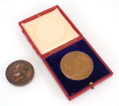 A cased 1902 Edward VII Coronation Medal together with a Services medallion from the Exhibition of