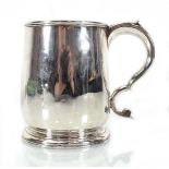 A George I Britannia silver tankard of typical form with c-scroll handle, London 1718, h. 11 cm,