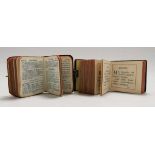 Miniature volumes. Book of Common Prayer, C.1890. Ribbed calf spine, grained wooden boards. Silver