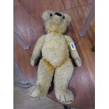 An early/mid 20th century English fully jointed bear, l. 52 cmIn need of attention