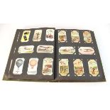 An album of cigarette cards including Badges & Flags of British Regiments (22), Will's Aviation (28)