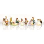 Eleven Beswick and Royal Albert Beatrix Potter figures comprising:Mrs Flopsy Bunny,Sir Isacc