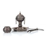 An Omani silver incense burner repousse decorated in the traditional manner, h. 15.5 cm, together