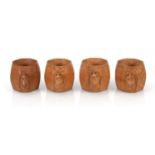 A set of four Robert 'Mouseman' Thompson carved oak napkin rings bearing the signature mice