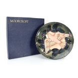 A Moorcroft limited edition cabinet plate for 1993 decorated with a dove in flight, d. 22 cm, boxed