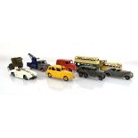 Eight post-war Dinky models including a Dunlop Trojan van, a 133 Cunningham, an Amstrong Siddeley