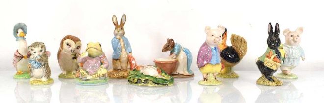 Eleven Beswick and Royal Albert Beatrix Potter figures comprising:Anna Maria,Sally Henny Penny,Peter