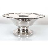 An early 20th century silver dish of octagonal form raised on a socle foot, makers mark