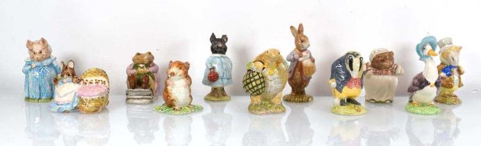 Eleven Beswick and Royal Albert Beatrix Potter figures comprising:Amiable Guinea-Pig, Mr Jackson,