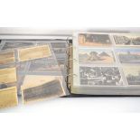 An album containing approximately three hundred and forty postcards including several pages relating