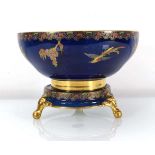 A Carltonware lustreware fruit bowl and stand, gilt decorated in coloured enamels with exotic