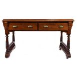 A late 19th/early 20th century mahogany writing desk in the manner of Pugin, the tooled green