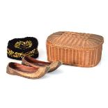 A pair of late 19th/early 20th century leatherwork slippers together with an embroidered hat and a