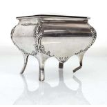 An Edwardian silver trinket box of sarcophagus form raised on four outswept legs, William Hutton &