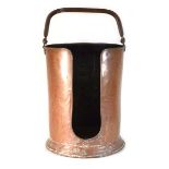 An early 20th century copper plate holder with swing handle, h. 44 cm