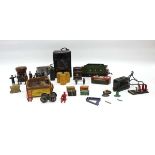 A group of O gauge accessories including a tender, transformer, barrels, luggage and other items (