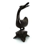A Chinese bronze censer modelled as a duck, on an associated plinth, h. 33 cm*Previously