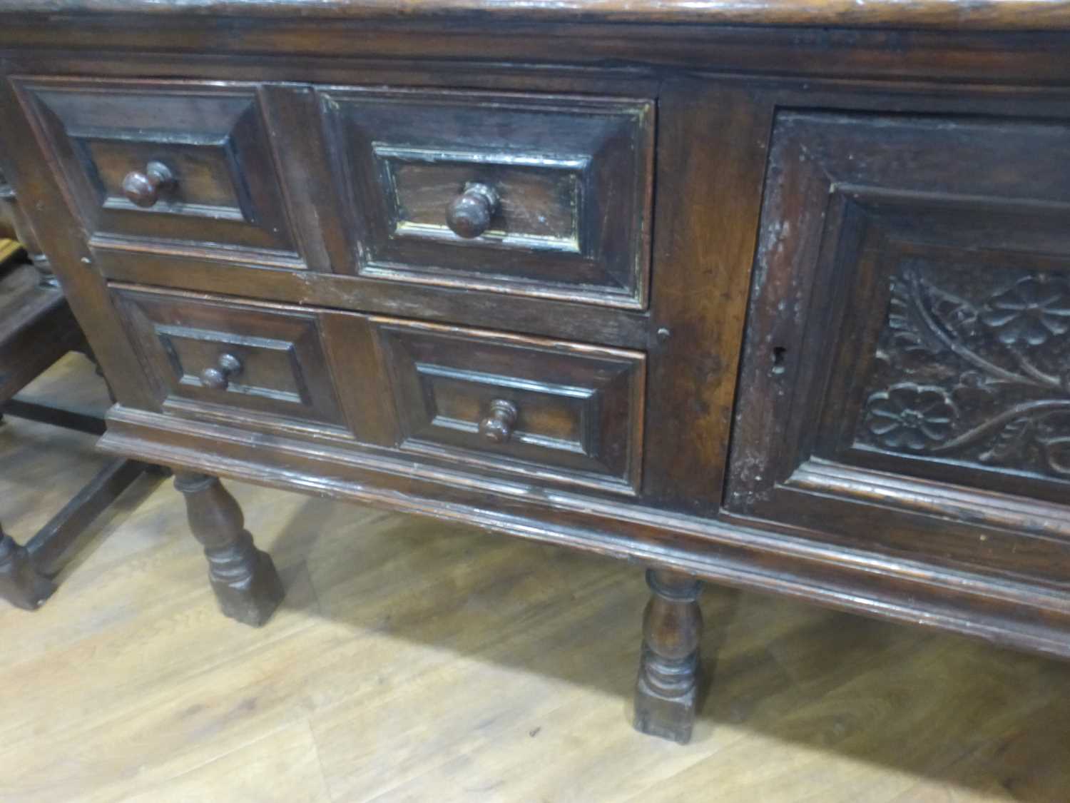 An oak dresser base incorporating 17th century elements, the central carved panelled door flanked by - Bild 6 aus 24