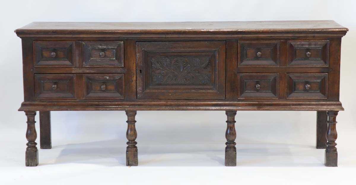 An oak dresser base incorporating 17th century elements, the central carved panelled door flanked by - Bild 2 aus 24