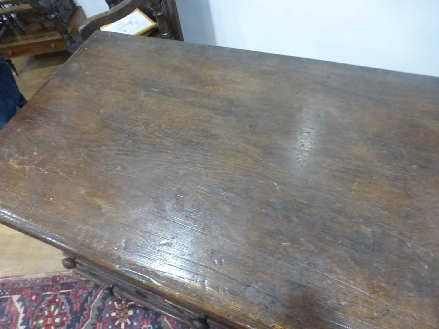 An oak dresser base incorporating 17th century elements, the central carved panelled door flanked by - Bild 11 aus 24