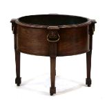 A George III mahogany cellarette with brass handles, lead liner and tapering legs, 70 x 55 cmThe