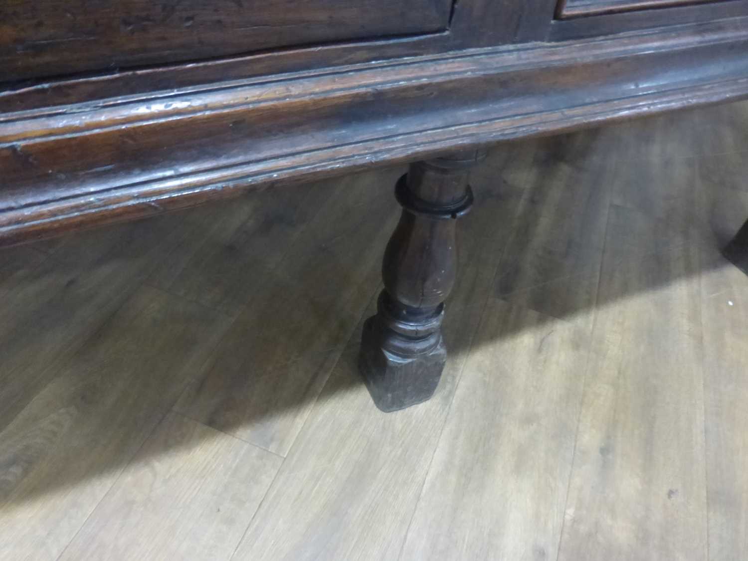 An oak dresser base incorporating 17th century elements, the central carved panelled door flanked by - Bild 5 aus 24