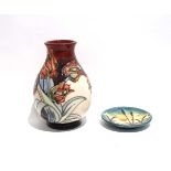 Sally Tuffin for Moorcroft, a vase decorated in the 'Red Tulips' pattern, h. 20 cm, together with