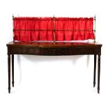 A 19th century mahogany serpentine buffet or side table, the brass superstructure with a fitted