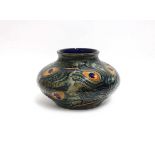 A Moorcroft bowl of squat form decorated in the 'Peacock Feathers' pattern, h. 13 cmNo obvious