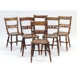 A harlequin set of six early 19th century Provincial kitchen chairs with elm seats and fretwork back