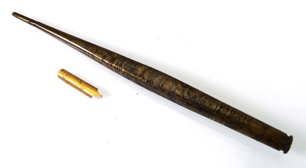 A Japanese brass pen with a gilt metal nib