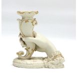 A late 19th/early 20th century parianware vase modelled as a hand holding a nautilus shell,
