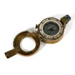 A Second World War compass stamped 'T.G. Co. Ltd, London, No. B27909 1940 Mk III'