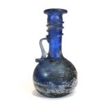 An iridescent blue glass jug in the archaic manner, h. 16 cm