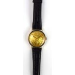 A gentleman's 14ct yellow gold wristwatch by Gruen, the circular sunburst engraved dial with baton