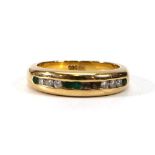 A 14ct yellow gold ring set small diamonds and emeralds in a channel-type setting,ring size L,5.1