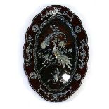 A Japanese black lacquered tray decorated with mother-of-pearl motifs and birds, on a faux