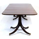 A Georgian-style mahogany, strung and walnut crossbanded twin-pedestal dining table with two