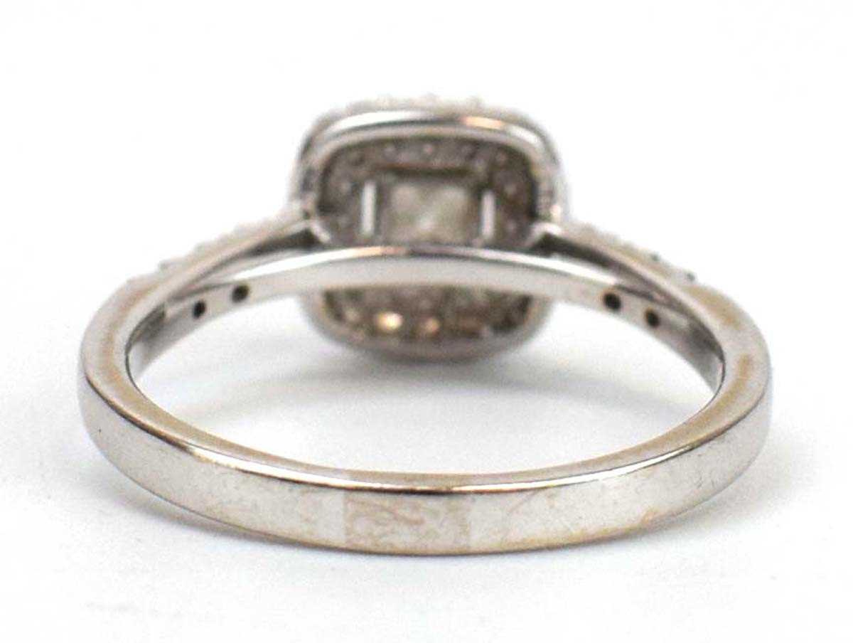 An 18ct white gold halo ring set centrally with a princess cut diamond within a double border of - Image 3 of 4