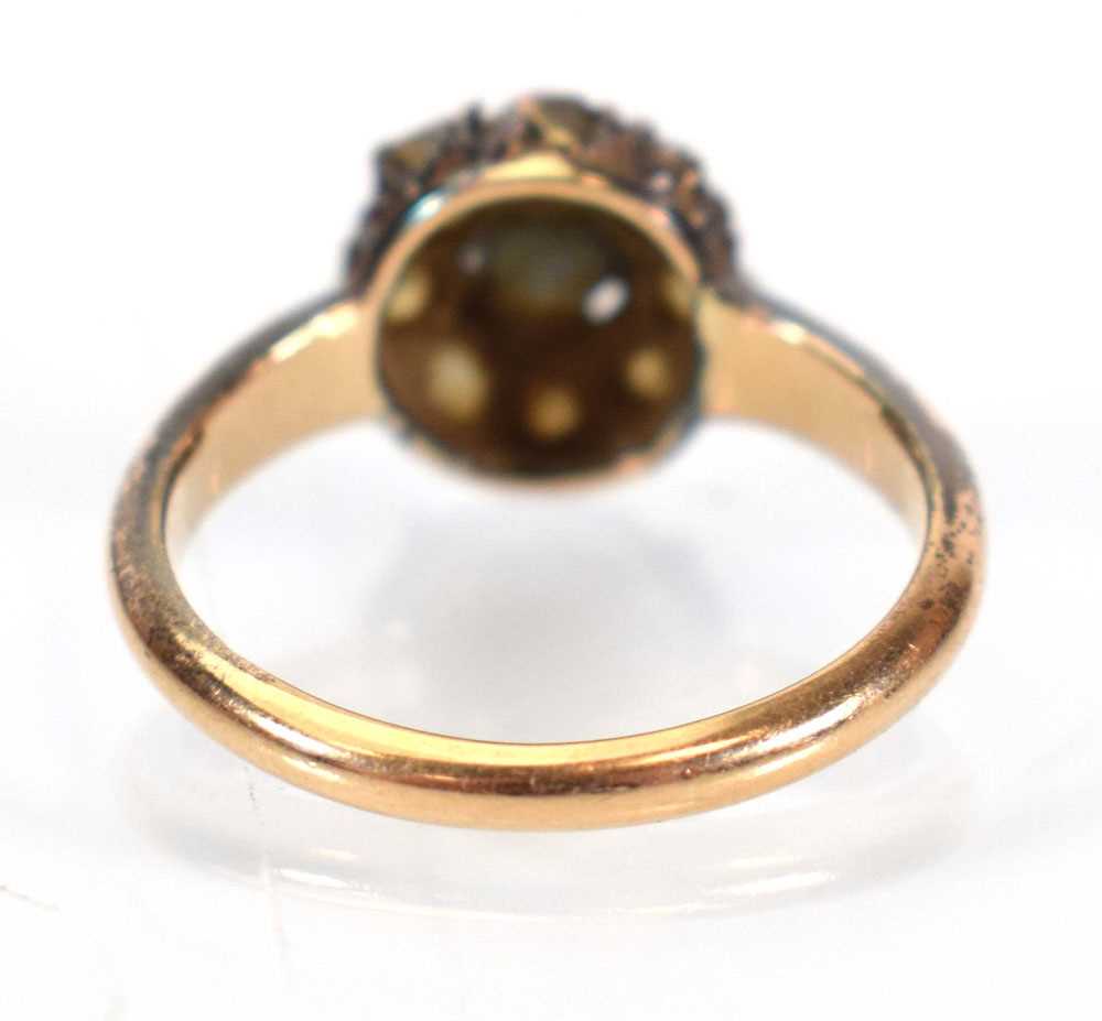 An early 20th century 15ct yellow gold cluster ring set round cut sapphire within a border of - Image 3 of 4