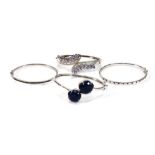 Four silver hinged bracelets set black diamonds, lapis lazuli, tanzanite and sapphire (4)