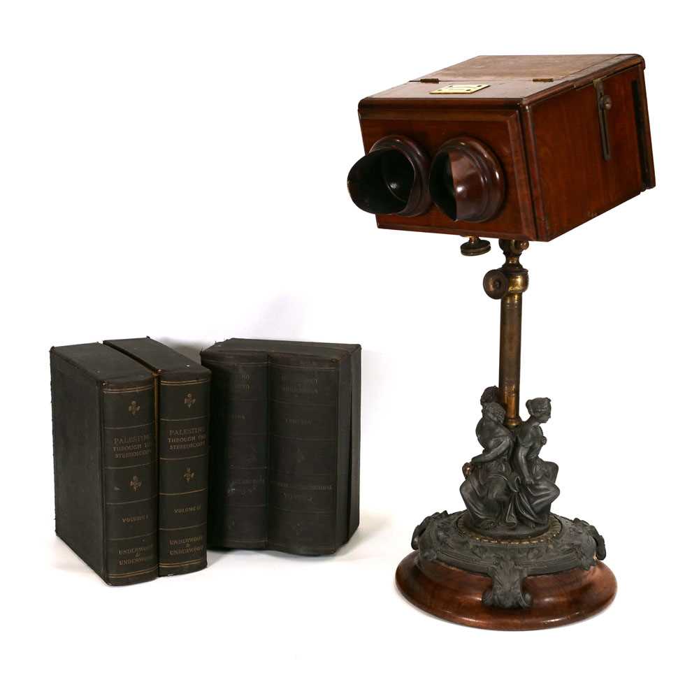 A Negretti & Zambra stereoscopic table viewer, the mahogany box with twin eye shields and ivory