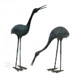 A pair of bronze verdigris figures modelled as cranes, max. h. 84 cmThere is some rubbing to one