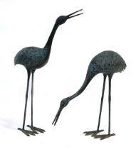 A pair of bronze verdigris figures modelled as cranes, max. h. 84 cmThere is some rubbing to one